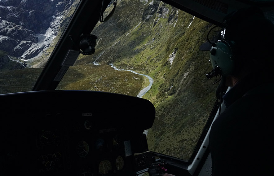 View of valley with rivers from helicopter cabin, by thomas hetzler